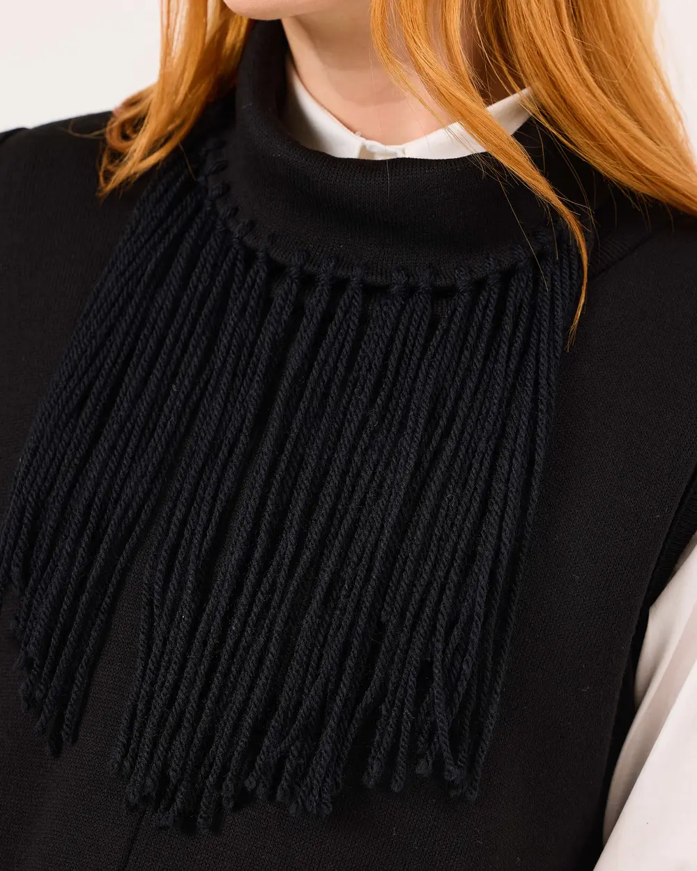 Sleeveless Asymmetric Sweater with Tassel Detail