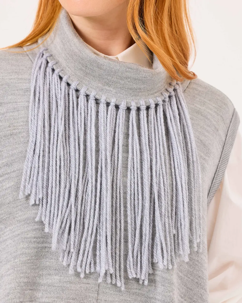 Sleeveless Asymmetric Sweater with Tassel Detail